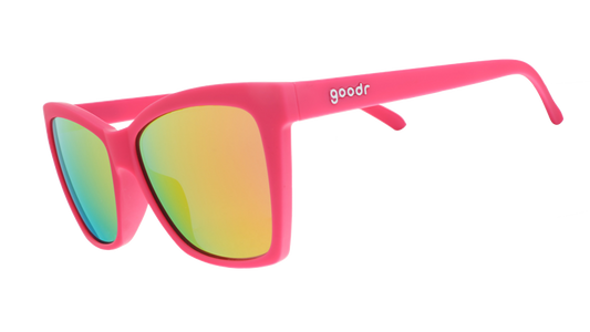 Three-quarter angle view of hot pink angled cat-eye sunglasses with pink reflective lenses.